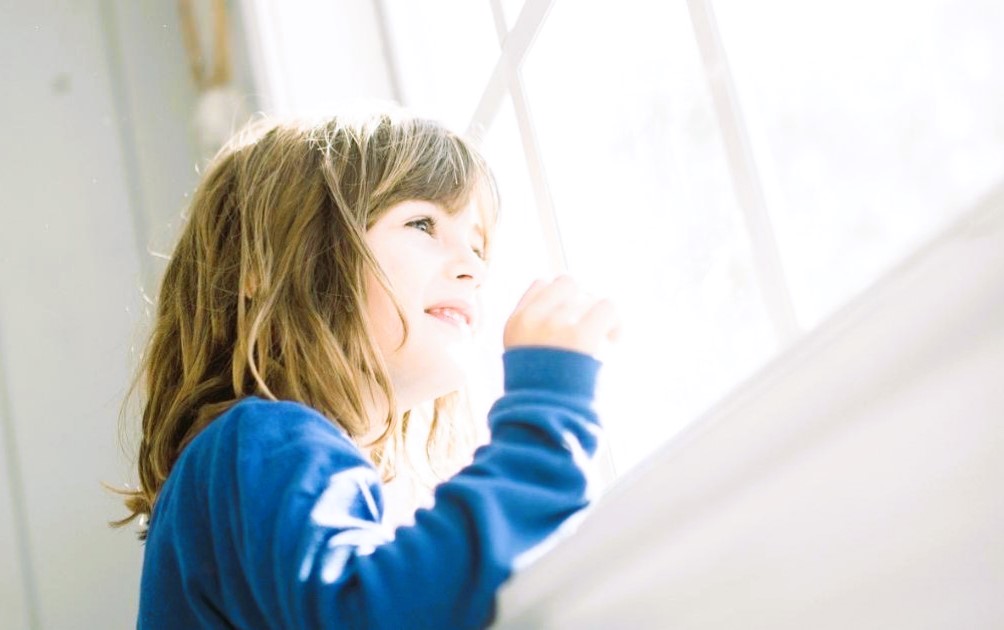 girl looking out the window